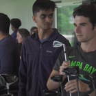 New osteopathic students check out golf clubs during a tour of a local business. 